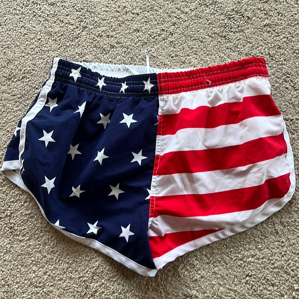 Board shorts. Swim trunks. Patriotic colors. Split sides.